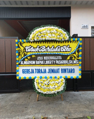 Papan Bunga Duka di Wegee Bino